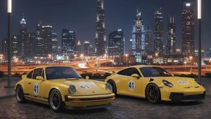 Two yellow Porsches with racing number 73 parked before the Dubai skyline at night