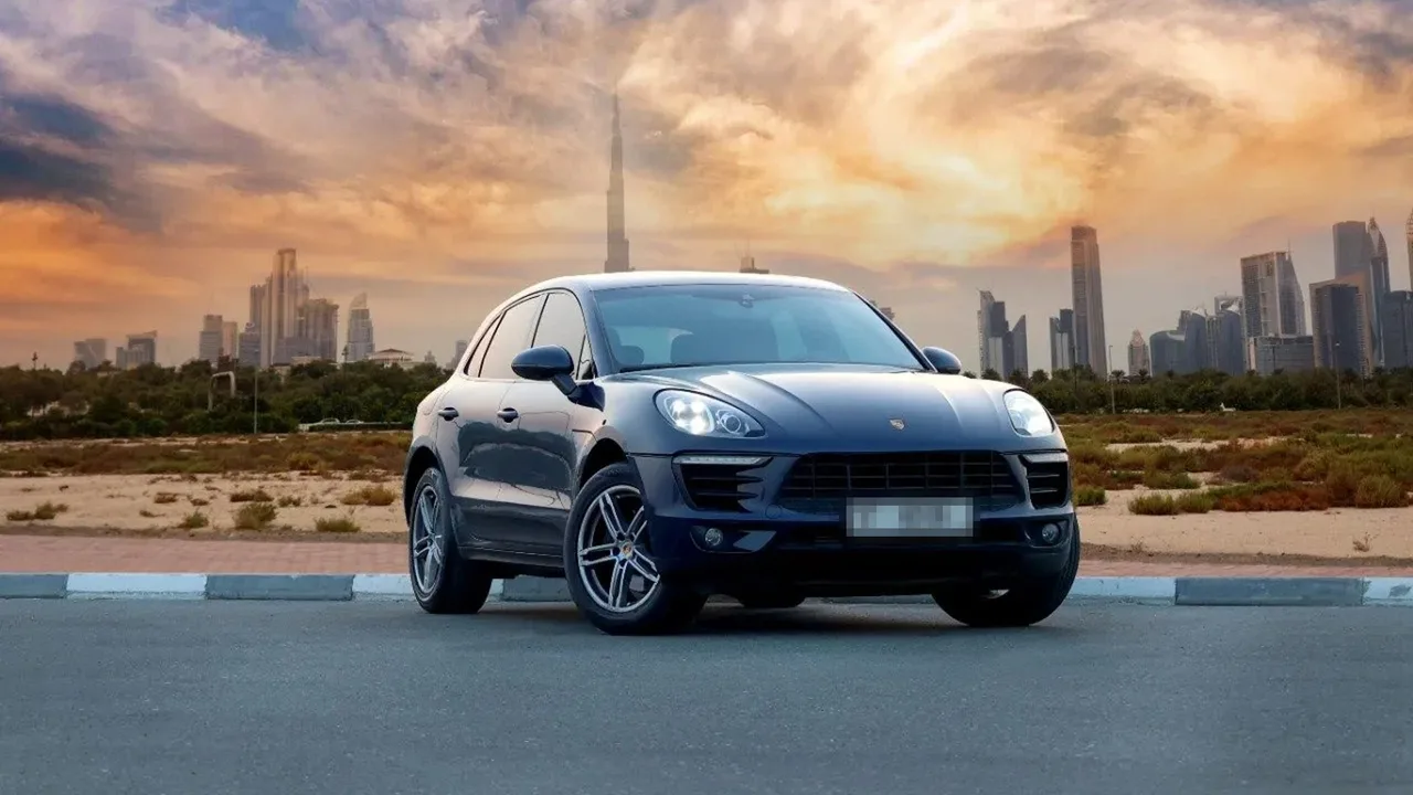Porsche Macan parked with the Dubai skyline at sunset — the common problems UAE owners report most